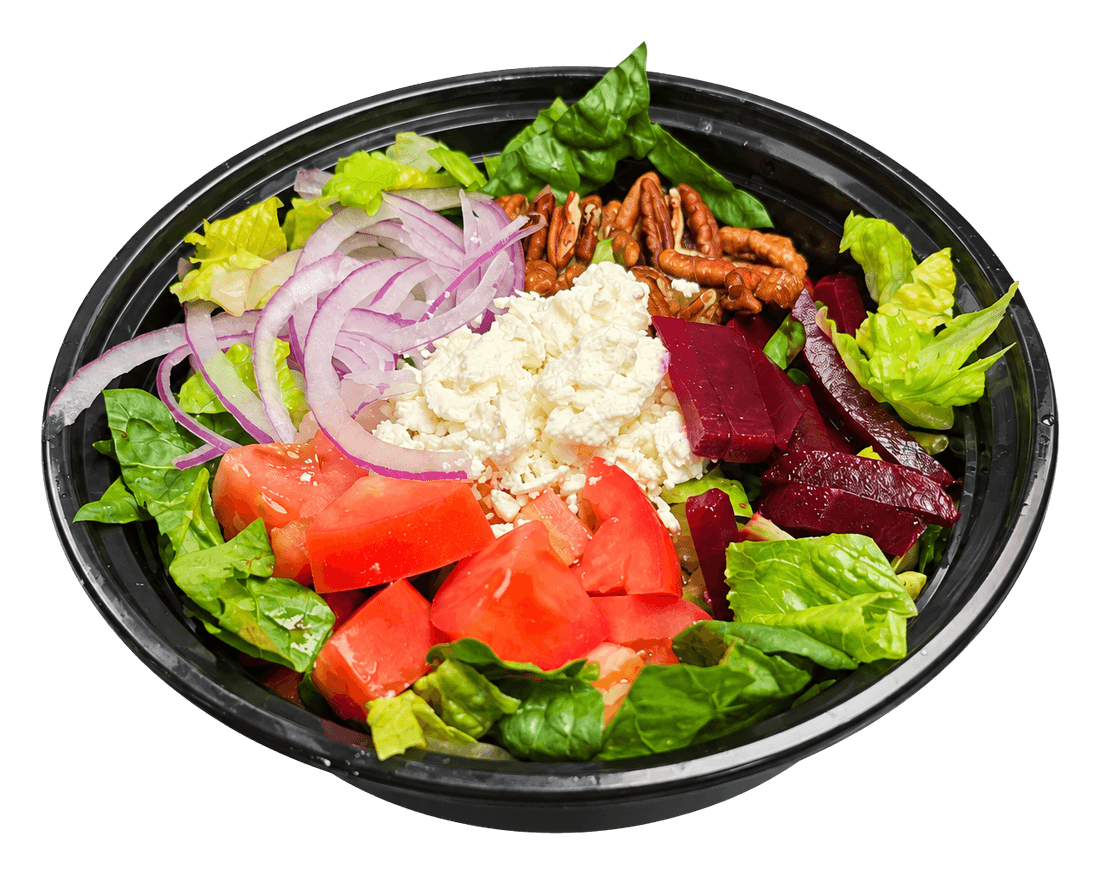 Black bowl of salad with lettuce, tomato, beet, red onion, feta and pecans.