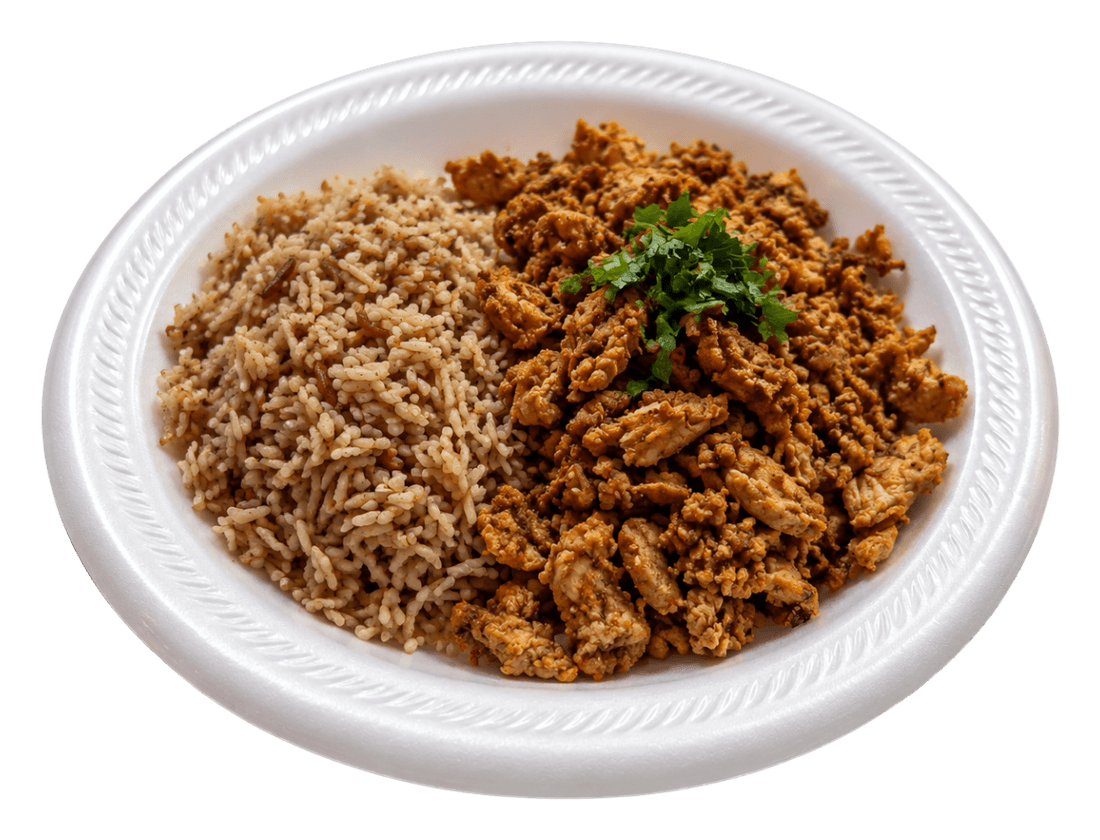 White plate with seasoned rice on one side and chicken pieces on the other.