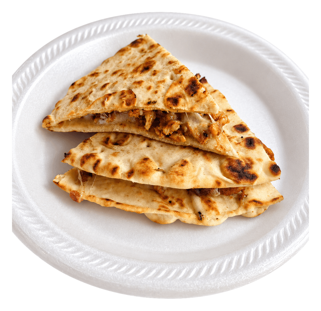 Toasted flatbread wedges filled with shawarma and melted cheese on a white plate.