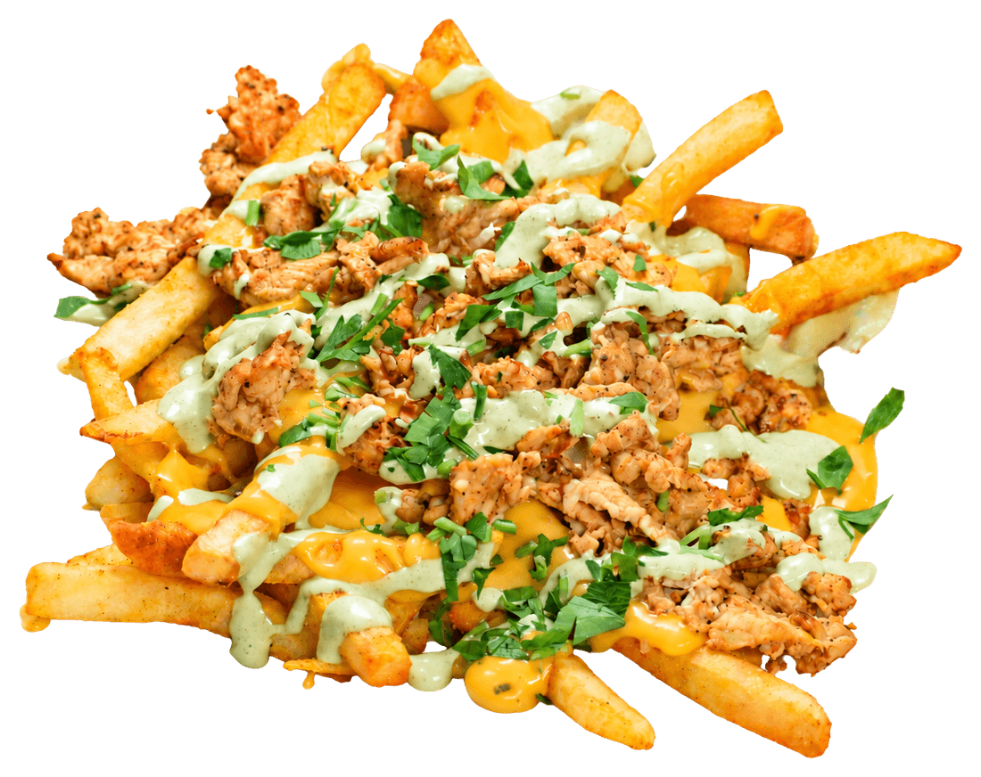 French fries covered in cheese sauce and chopped chicken, drizzled with green sauce and cilantro.